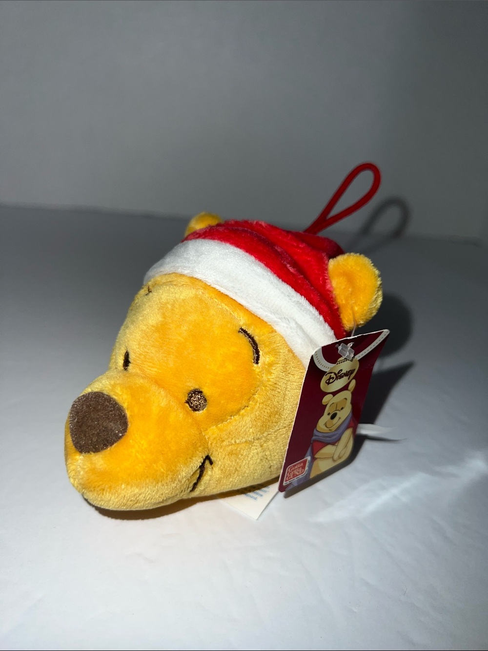 Vintage Disney Winnie the Pooh Plush Ornament in Yellow and Red Santa Hat NWT